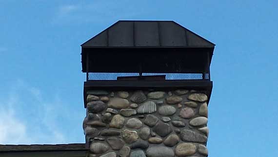 custom chimney cap bozeman - hip and ridge with standing seams